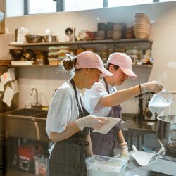 employees-pours-milk-into-bowl-making-dough-with-c-2021-09-04-07-16-34-utc